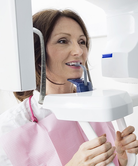 Woman receiving 3 D C T cone beam x-ray scan
