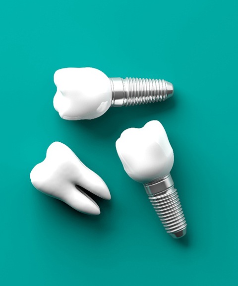 Dental implants on a turquoise background