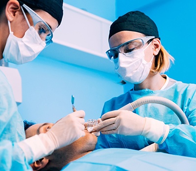 Dentists performing surgery