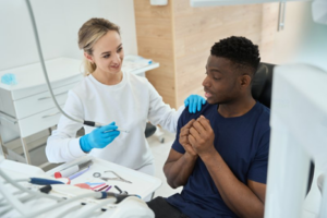 Dentist reassuring a nervous patient